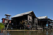 Inle Lake Myanmar. All the buildings are constructed on piles. Residents travel around by canoe, but there are also bamboo walkways and bridges over the canals, monasteries and stupas. 